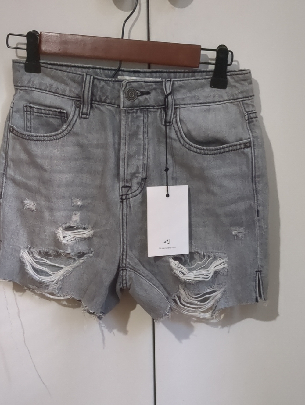 High-Rise Distressed Denim Shorts in Light Gray